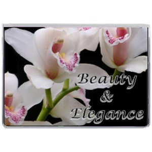 May include: A rectangular image featuring white orchids with pink and yellow accents against a black background. The words "Beauty & Elegance" are displayed in elegant script.