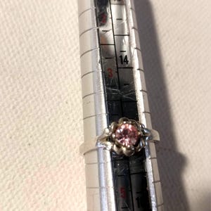 Vintage Sterling Silver Avon Ladies Ring. Adjustable. Silver ring with Sparkling Pink Gemstone.
