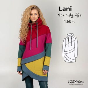 May include: A color-blocked tunic with a high collar and long sleeves. The tunic features a combination of red, pink, green, yellow, and blue panels. The text "Lani" and "Normalgröße 1,68m" are visible in the image, along with a line drawing of the tunic.
