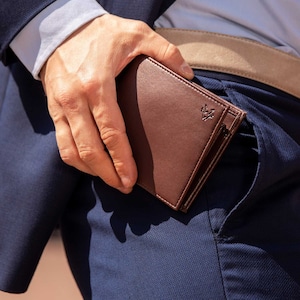 Handcrafted mens coin wallet in brown with RFID blocking technology. A lightweight wallet with 6 card pockets, a coin pocket with popper closure and a full-length pocket for notes and currency.