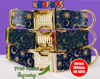May include: Three gold dog collars with a blue and gold celestial pattern. The collars have gold name plates with the names "Stella", "Bodi", and "Bella" and phone numbers. The text "Free Name Engraving" is at the bottom of the image.