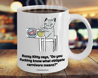 Kussy Kitty Says "Do You Fucking Know What Obligate Carnivore Means?" Offensive Coffee Mug - Great Gift For Cat Lovers (9 Options Available)