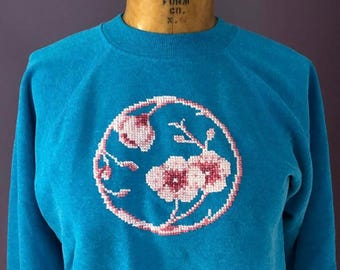 Sudadera vintage con mangas raglán y costuras cruzadas