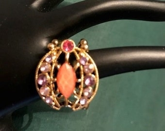Sandy peach hand-made stretchy ring surrounded with little purple gems and gold tone base