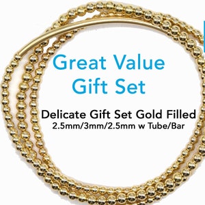 May include: A set of three gold-filled beaded bracelets with a tube and bar design. The bracelets are 2.5mm, 3mm, and 2.5mm in diameter. The set is called "Great Value Gift Set".