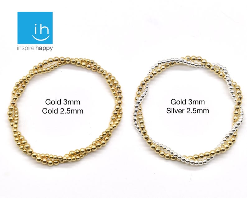 May include: Two beaded bracelets, one gold and one silver, are displayed against a white background. The gold bracelet is labeled "Gold 3mm Gold 2.5mm." The silver bracelet is labeled "Gold 3mm Silver 2.5mm."