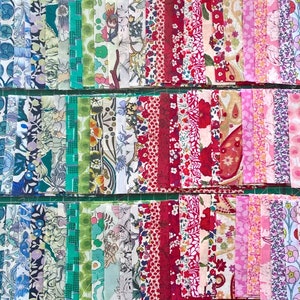 May include: A collection of fabric squares in various floral patterns, arranged in rows of blue, green, red, pink, and purple.