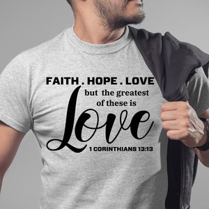 May include: A gray t-shirt with the text "FAITH. HOPE. LOVE but the greatest of these is Love 1 CORINTHIANS 13:13" printed in black.