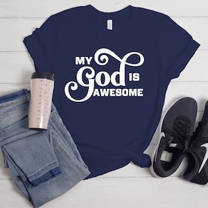 May include: A navy blue t-shirt with white text that reads "My God is Awesome".