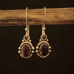 Earrings made of silver and a garnet gem stone