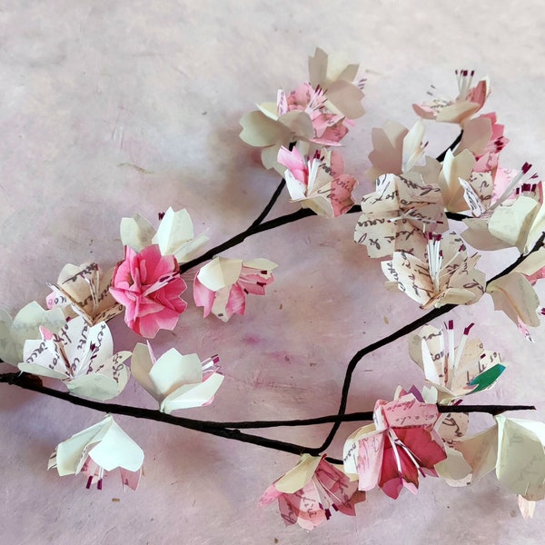 Japanese cherry tree branches in origami Romantic pink sakura flowers for flower bouquet composition, wedding table decoration, baptism