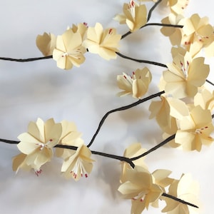 Japanese cherry blossom branches in origami Vanilla sakura flowers for bouquet composition and wedding baptism table decoration