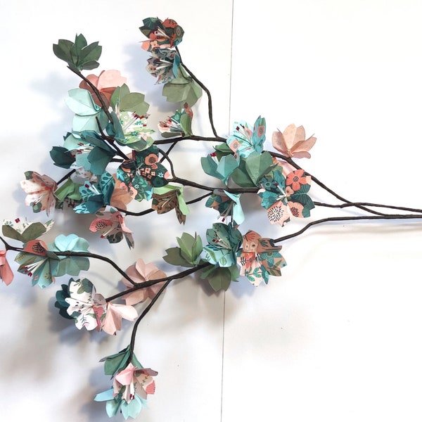 Japanese cherry tree branches in origami Multicolored sakura flowers for bouquet composition and wedding baptism table decoration