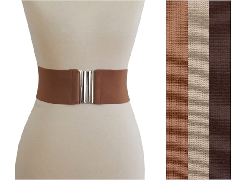 May include: A brown elastic belt with a silver buckle. The belt is shown on a white mannequin. The image also shows three different colors of the belt: brown, beige, and dark brown.