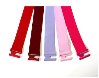 Elastische riem in rood, roze en bordeauxrood.