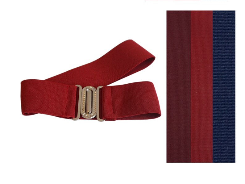 May include: A burgundy elastic belt with a silver-colored buckle. The belt is shown with a color swatch of burgundy, dark red, red, and navy blue fabric.