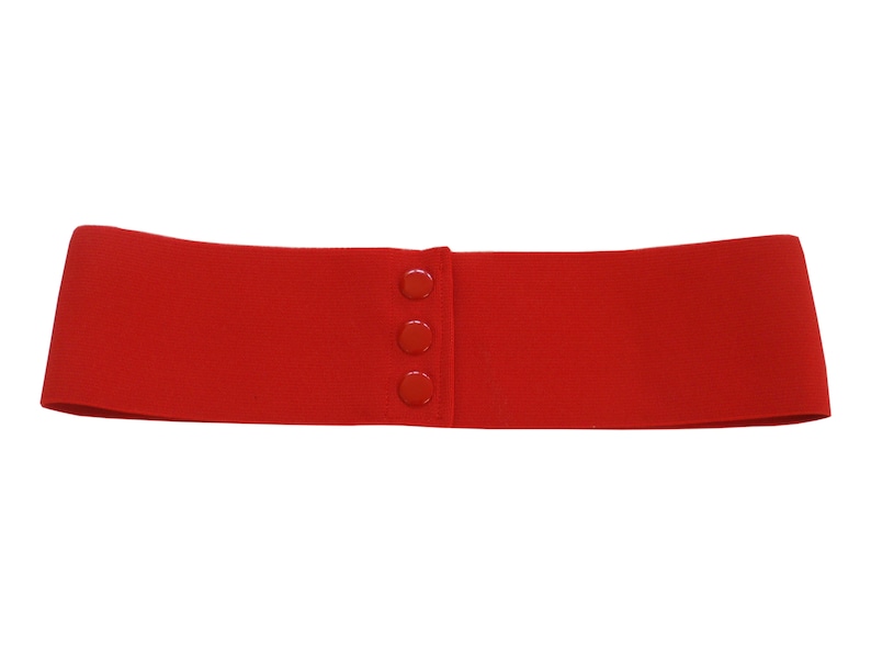 May include: A red elastic belt with four plastic buttons. The belt is made of a stretchy material and is designed to be worn around the waist.
