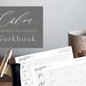 May include: A modern calligraphy workbook with the word "Calm" in elegant script. The workbook includes practice sheets with grid lines and basic stroke guides. A calligraphy pen is also visible.
