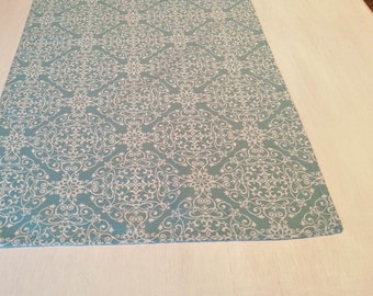 Beautiful table runner blue with white ornaments - for a stylish table decoration