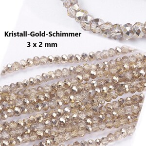 PERLINE DI VETRO GOLD SHIMMER zincate e sfaccettate, giochi di luce, semitrasparenti // 3 x 2 mm // 1 filo = 185 - 190 perle / dorate