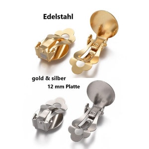 Könnte beinhalten: Zwei Paar Clip-Ohrringe, einer in Gold und einer in Silber, mit einer 12 mm Platte. Die Ohrringe sind aus Edelstahl und haben ein blumenförmiges Design.