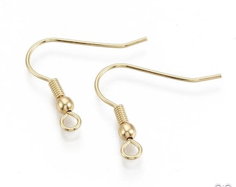 May include: Two gold-toned earring hooks with a small loop at the bottom. The hooks are made of metal and have a spring-loaded closure.