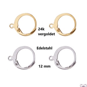 Könnte beinhalten: Zwei Paar Ohrhaken, ein Paar ist vergoldet und das andere ist silber. Das vergoldete Paar ist mit "24k vergoldet" beschriftet. Das silberne Paar ist mit "Edelstahl 12 mm" beschriftet.