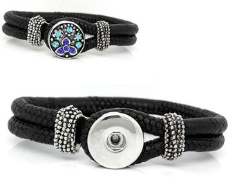 May include: Black leather wrap bracelet with a silver snap closure. The bracelet features a double-strand design and decorative silver accents. One bracelet has a blue and turquoise gem design on the snap.