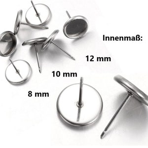 Könnte beinhalten: Silberne Ohrringrohlinge mit runder Basis und Stift. Die Rohlinge sind in drei Größen erhältlich: 8 mm, 10 mm und 12 mm. Innenmaß: 12 mm