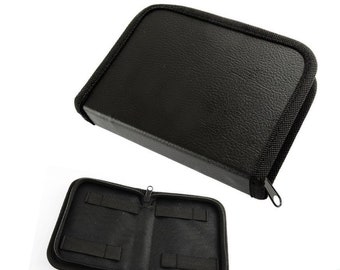 May include: Black zippered case with multiple compartments for storing small items. The case is open to reveal the interior compartments.