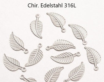 May include: A collection of 14 silver leaf charms made of surgical stainless steel 316L. The charms have a loop at the top for attaching to jewelry or other crafts.