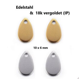 Könnte beinhalten: Vier tropfenförmige Schmuckanhänger mit den Maßen 10 x 6 mm. Zwei Anhänger sind goldfarben mit 18k Gold-IP-Beschichtung, zwei sind aus silberfarbenem Edelstahl. Jeder Anhänger hat oben eine kleine kreisförmige Öffnung zur Befestigung.