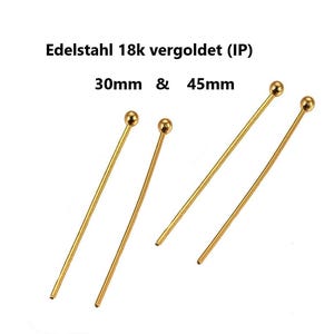 Peut inclure: Épingles à tête dorées. Le texte sur l'image indique "Edelstahl 18k vergoldet (IP)" et "30mm & 45mm". Les épingles ont une boule au sommet et sont disponibles en longueurs de 30 mm et 45 mm.