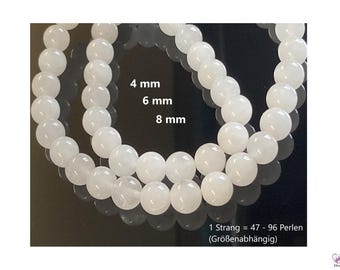 May include: Two strands of white round beads, one strand of 4 mm beads, one strand of 6 mm beads, and one strand of 8 mm beads. The text on the image reads: "1 Strang = 47 - 96 Perlen (Größenabhängig)"