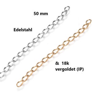 Può includere: Due prolunghe per catena da 50 mm, in acciaio inossidabile e placcate in oro. La catena argentata è etichettata "Edelstahl". La catena dorata è etichettata "& 18k vergoldet (IP)". Entrambe le catene hanno un design a maglie ovali ripetute.