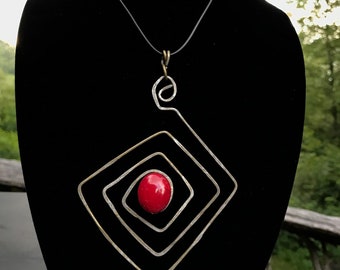 Oversize Diamond shaped aged recycled  brass wire pendant featuring red oval stone in center