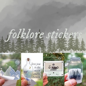 May include: Four clear stickers with a folklore theme. The stickers feature a mountain range, a bottle with a crescent moon, a cassette tape with the word "folklore" on it, and a mason jar with a forest inside.