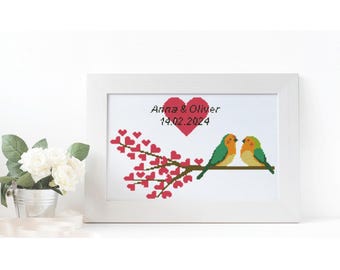 Pode incluir: Uma moldura branca com fundo branco e um coração vermelho com o texto "Anna & Oliver 14.02.2024" acima de dois pássaros em um galho com corações rosa.