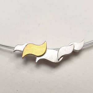 Large wave pendant in silver and gold