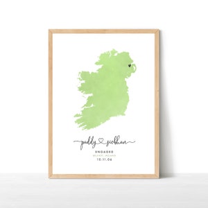 May include: A green watercolour illustration of Ireland with a black heart marking Belfast. The text below reads "Paddy ♥ Siobhan Engaged Belfast, Ireland 10.11.06".