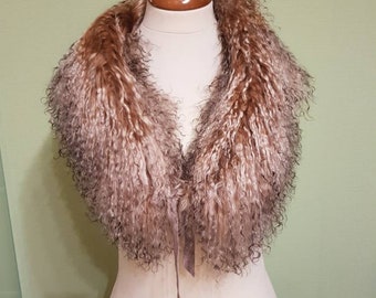 May include: A brown and white faux fur collar with a long, thin, light brown ribbon tie.