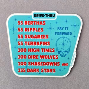 May include: A blue and white sticker with a retro diner sign design. The sticker features the text "DRIVE-THRU" and a list of song titles with quantities, including "55 Berthas", "55 Ripples", "55 Sugarees", "55 Terrapins", "100 High Times", "100 Dire Wolves", "100 Shakedowns", and "155 Dark Stars". The sticker also includes the text "PAY IT FORWARD" and a stylized image of a skull with a star in its head.