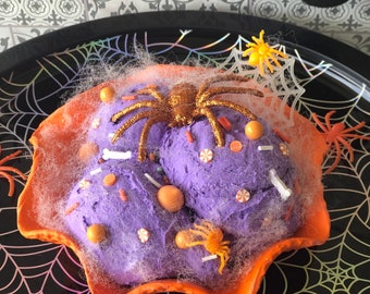 Fake ice cream in a waffle bowl for Halloween trick or treat sweet orange and purple tier tray decor