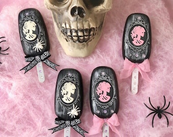 Fake Halloween cakesicles , fake Halloween sweets, Halloween cakesicles, Faux Halloween treats, Spooky skeleton Lady, Halloween Skeletons