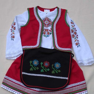 An original modern version of a folk costume for a girl.