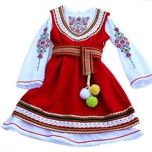 An original modern version of a folk costume for a girl.