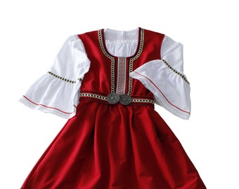 An original modern version of a folk costume for a girl.