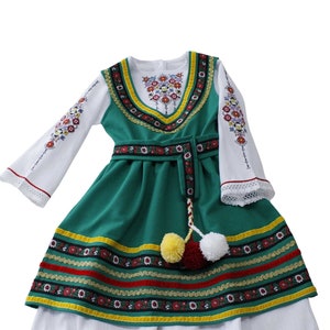 An original modern version of a folk costume for a girl.