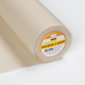 May include: A roll of white Decovil Light interfacing fabric. The fabric is a lightweight, fusible interfacing that is used to stabilise and add body to fabrics.