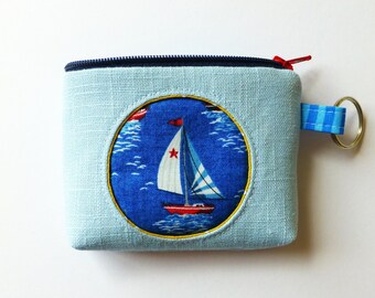 maritime peephole mini bag with sailing boat, maritime key case for the summer holidays, blommablu